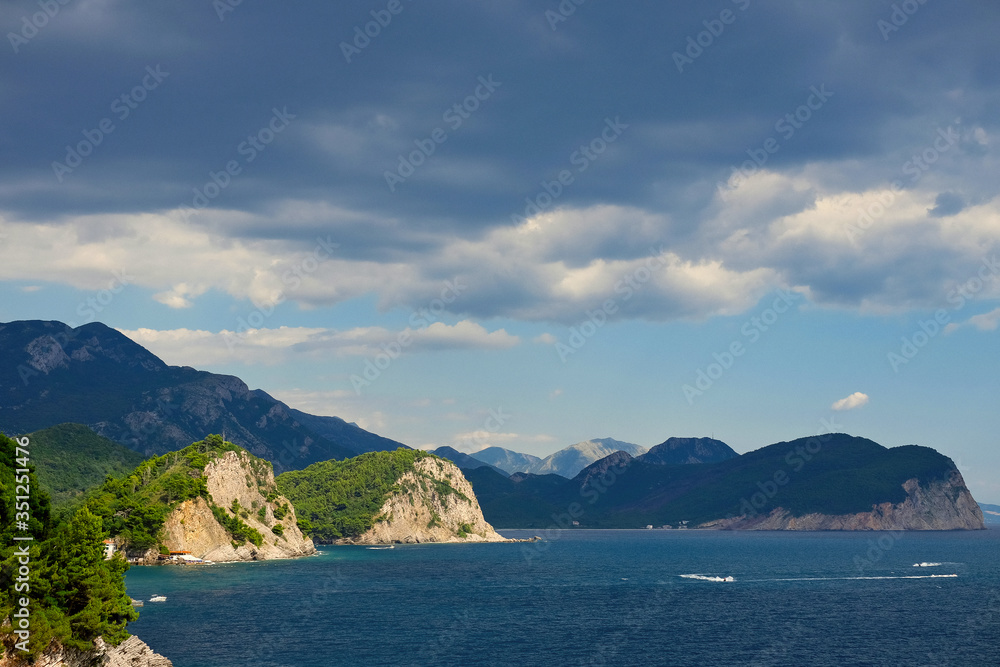 Mountains on the Adriatic Sea under large clouds Mountains on the Adriatic Sea under large clouds