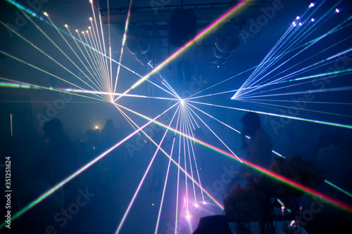  laser beam lights at a party with various colors