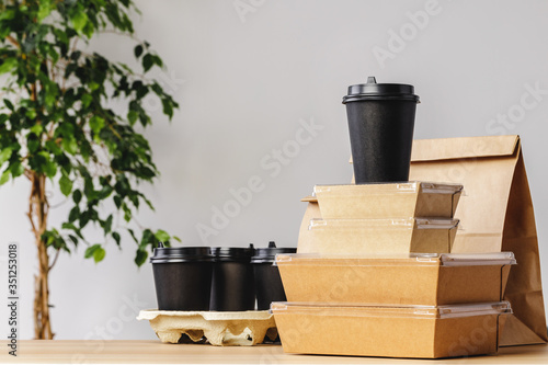 Assortment of various food delivery containers on table
