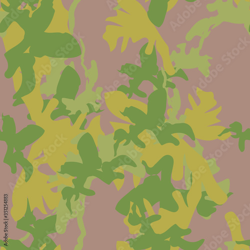 Forest camouflage of various shades of green, brown and yellow colors