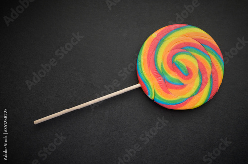 Natural looking lollipop on dark background.