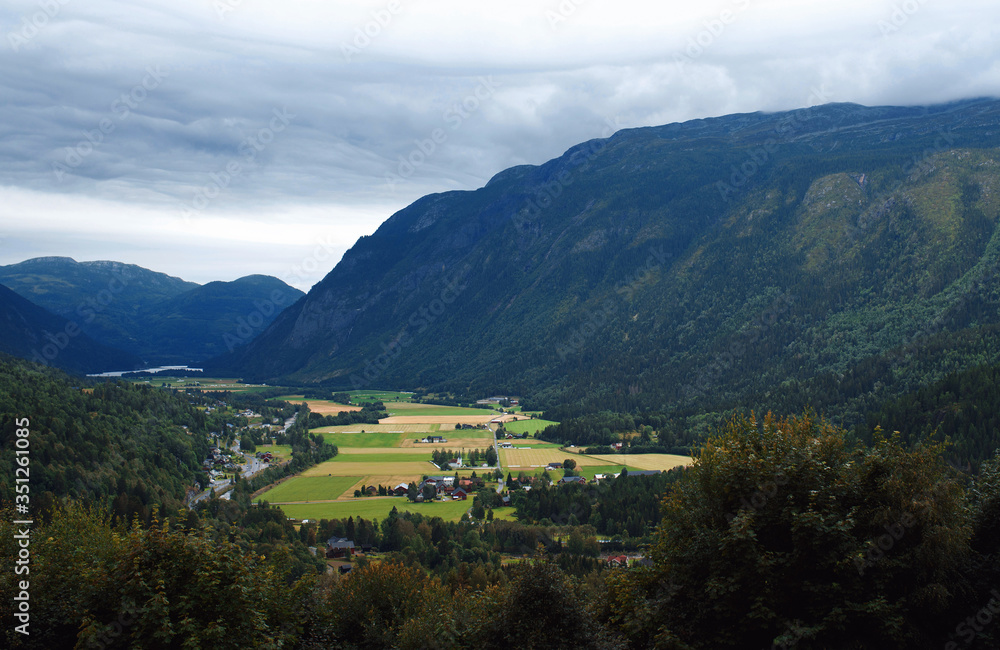 village on foot of norwegian mountain