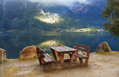 wooden place for picnic at lake shore