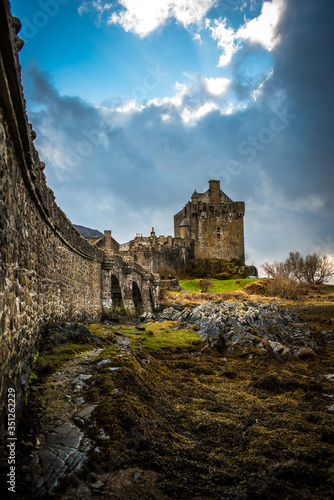 panoramic view on Eileen Donan Castle with a moody cloudy sky 