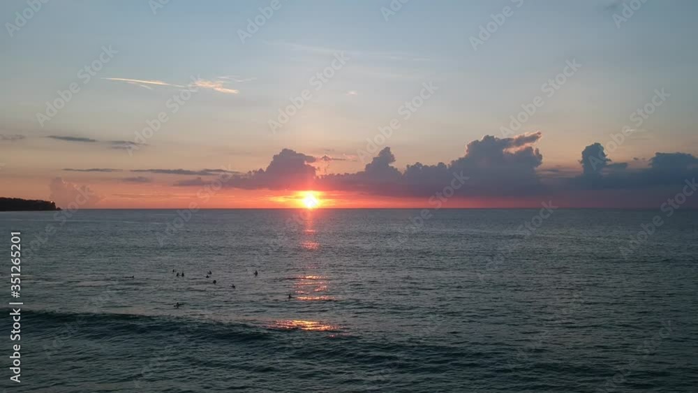 camera jib up beautiful sunset with big bright sun and beautiful clouds finely visible surfers camera jib up beautiful sunset with big bright sun and beautiful clouds finely visible surfers