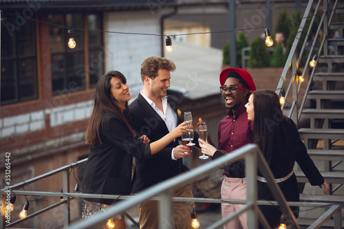 Photography Young people celebrating, look happy, have party at office or bar