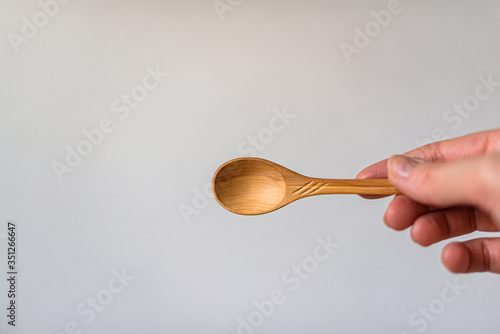 hand holding spoon