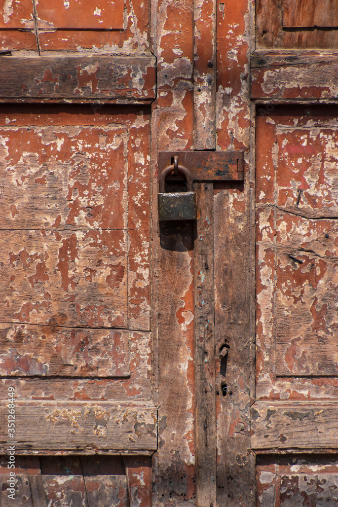 Old wooden door with lock Old wooden door with lock