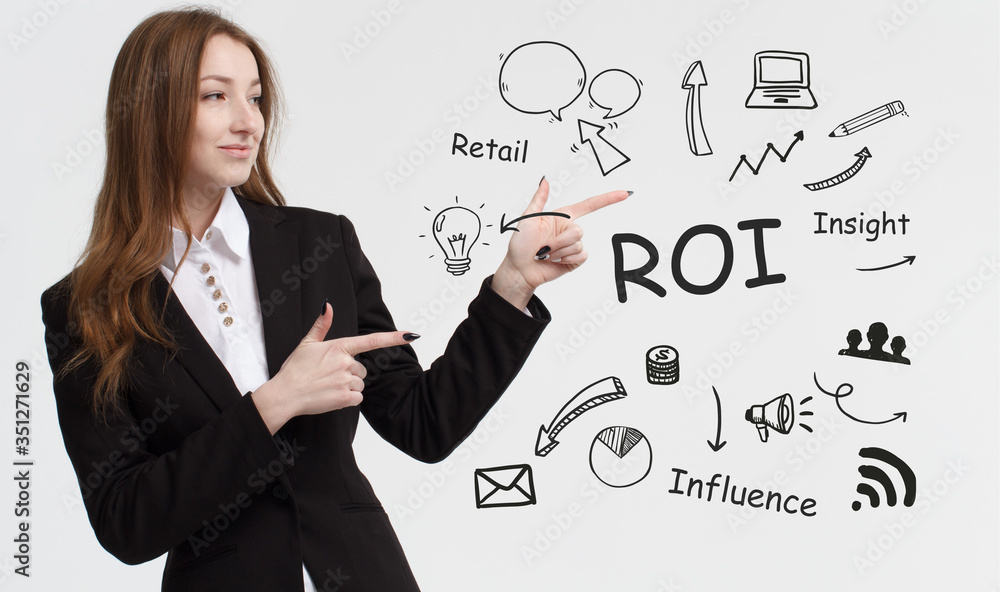 Business, technology, internet and network concept. Young businessman thinks over ideas to become successful: ROI Business, technology, internet and network concept. Young businessman thinks over ideas to become successful: ROI