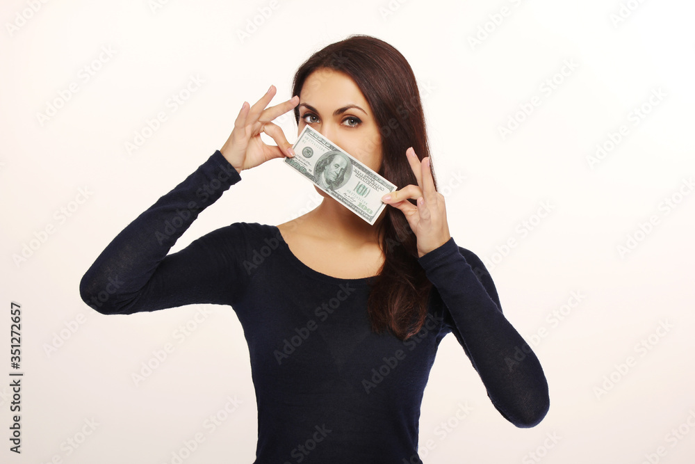 Portrait of young pretty woman with dollar over her face over white background Portrait of young pretty woman with dollar over her face over white background