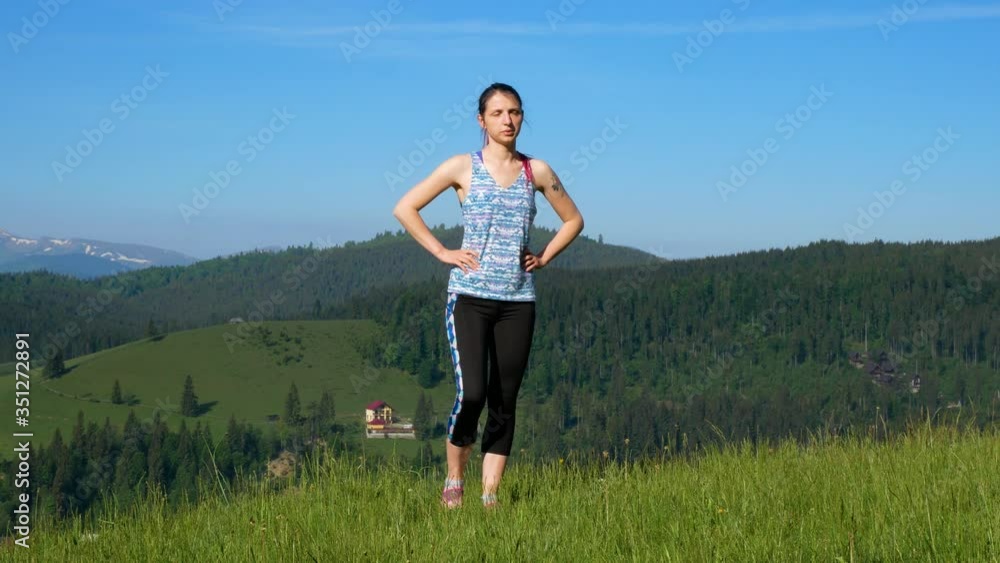 Girl doing warm-up in the mountains. Girl doing warm-up in the mountains.