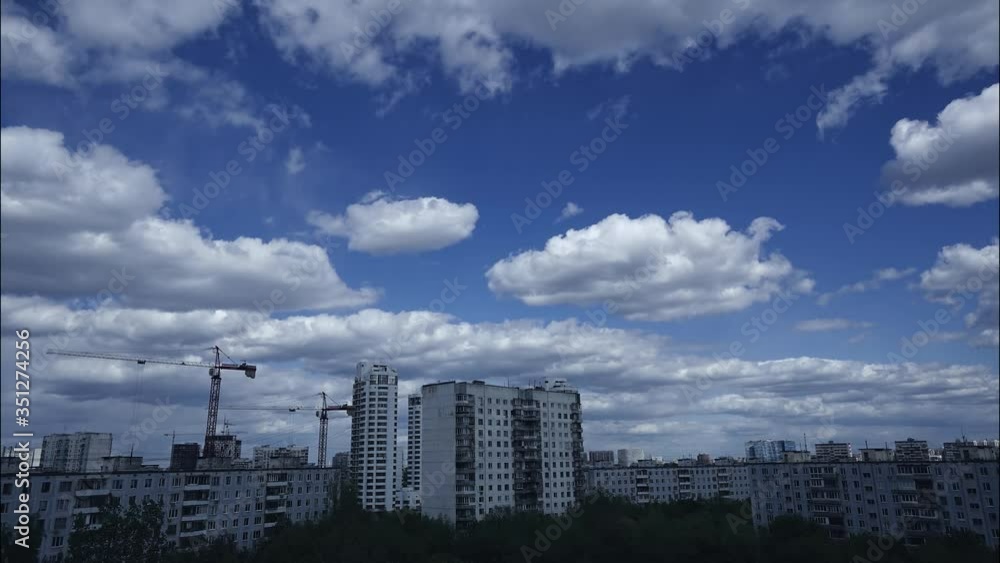 Time-lapse of clouds over the city and the building in the spring. Time-lapse of clouds over the city and the building in the spring.