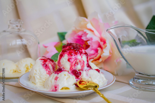 Still-life. Ice-cream Ice-cream with jam. Peonies. Sweets.
