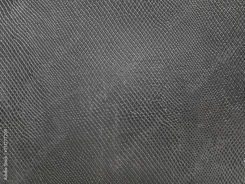 black snake skin background is luxurious. When placing your product, it will make the product look elegant and expensive, perfect for watches or white products. copy space for your text