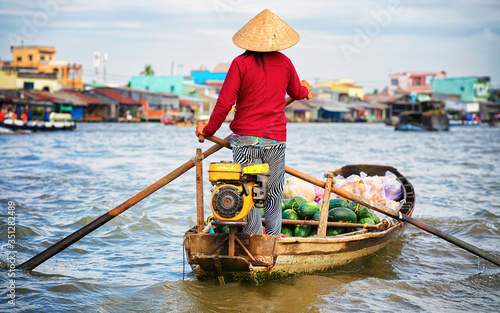 Woman selling watermelon at Floating market at Mekong Can Tho reflex photo