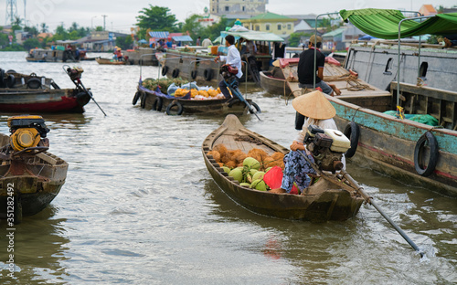 Woman selling fruit at Floating market Can Tho Vietnam reflex photo