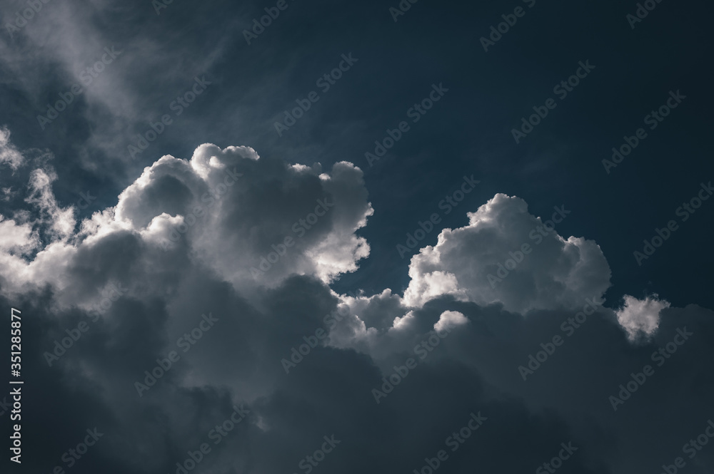 Large white cumulus clouds against a blue sky Large white cumulus clouds against a blue sky