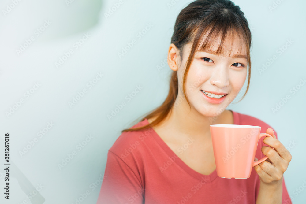 Young Asian woman drink coffee in the morning Young Asian woman drink coffee in the morning