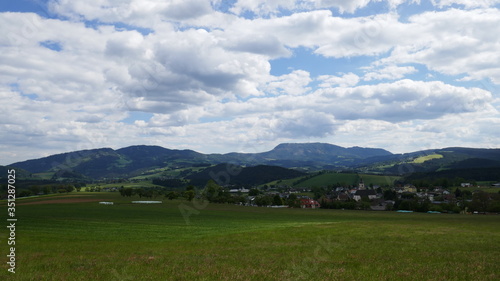 Field and mountains, beautiful landscape in Austria in a village.