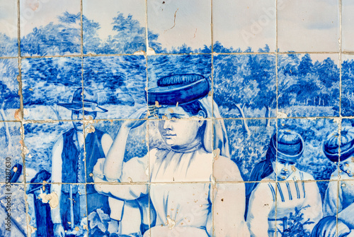 azulejos panels on the facade of the old railways station describing grape harvesting time in Aveiro, Portugal