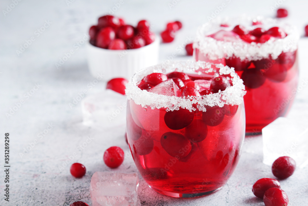 Glasses with red cranberry cocktail Glasses with red cranberry cocktail