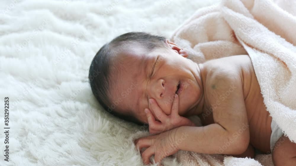 Newborn baby sleepy and yawn in the bed there are soft cushions in the bedroom. The idea for children must be viewed and closely seen by parents. Newborn baby sleepy and yawn in the bed there are soft cushions in the bedroom. The idea for children must be viewed and closely seen by parents.