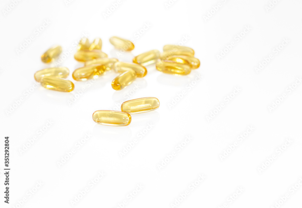 Omega 3 yellow soft gel pills isolated on white background. Copy space Omega 3 yellow soft gel pills isolated on white background. Copy space