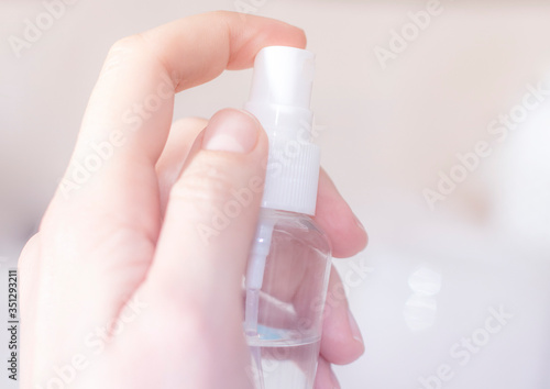 Antiseptic concept: antibacterial spray for hands, close-up