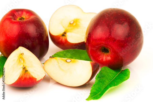 Red apple with green leaves