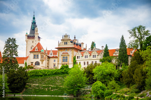 Castle with reflection in pond in spring time in Pruhonice, Czech Republic