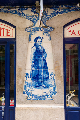 old advertising azulejos panel of Leitaria A Camponesa in Lisbon, Portugal photo