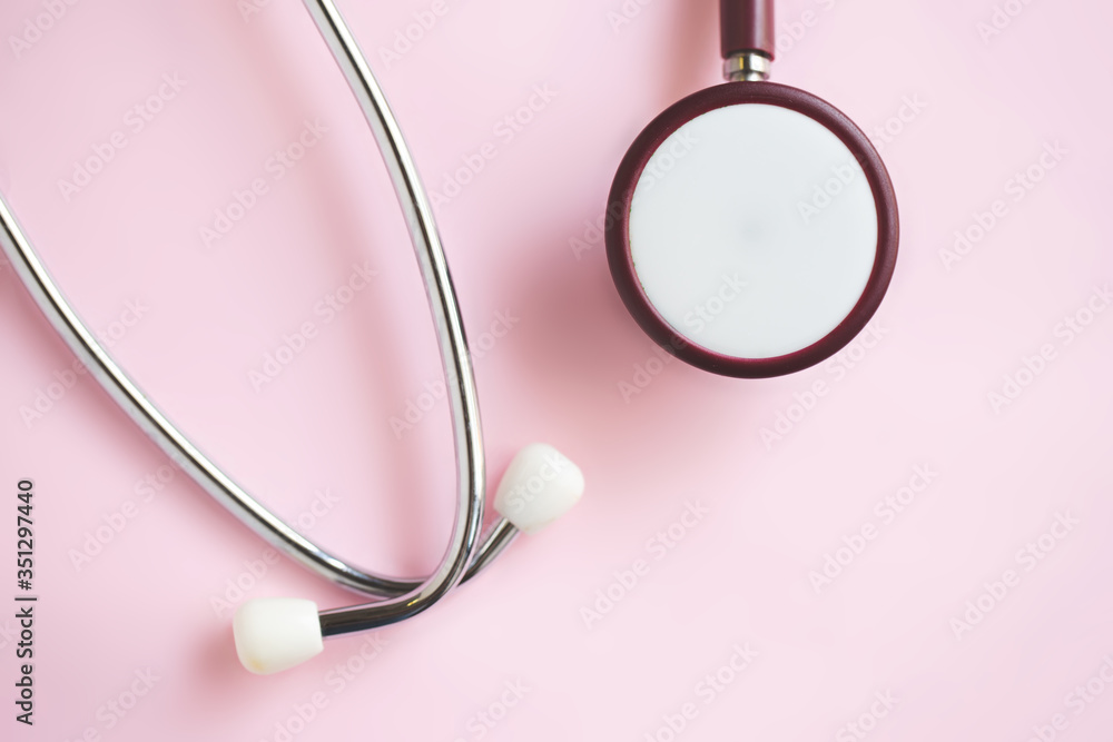 Fototapeta premium Medical stethoscope on pink background