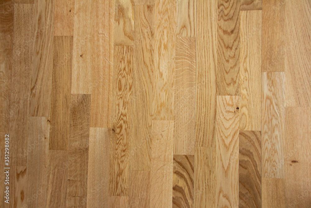 Fototapeta premium Parquet floor with a light brown with sheets and very straight parallel