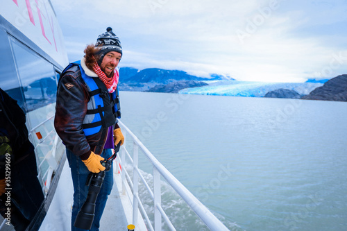 Glacier Gray, Chile - March 09, 2020: Happy and Smiling Man Tourist on the Boat to Glacier Gray 