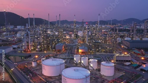 Aerial view. Oil refinery factory and oil storage tank at twilight and night.  photo