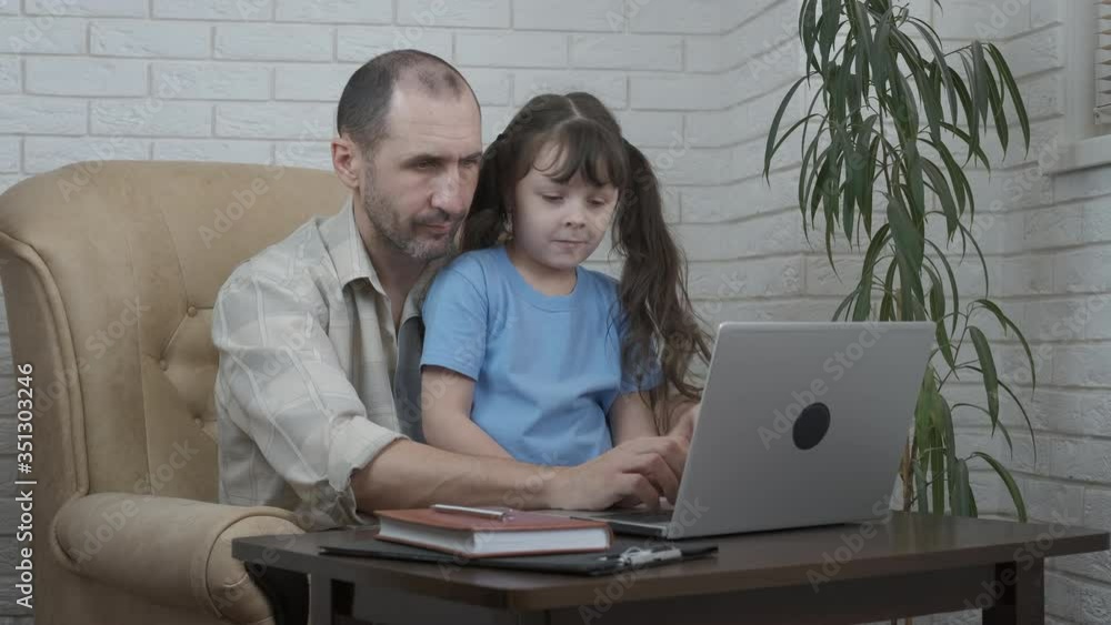 Home Office. Dad with daughter at a laptop. Home Office. Dad with daughter at a laptop.