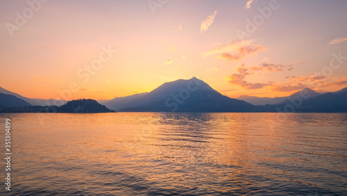 Panoramic view of sunset behind Alps mountains and Como lake  Italy.