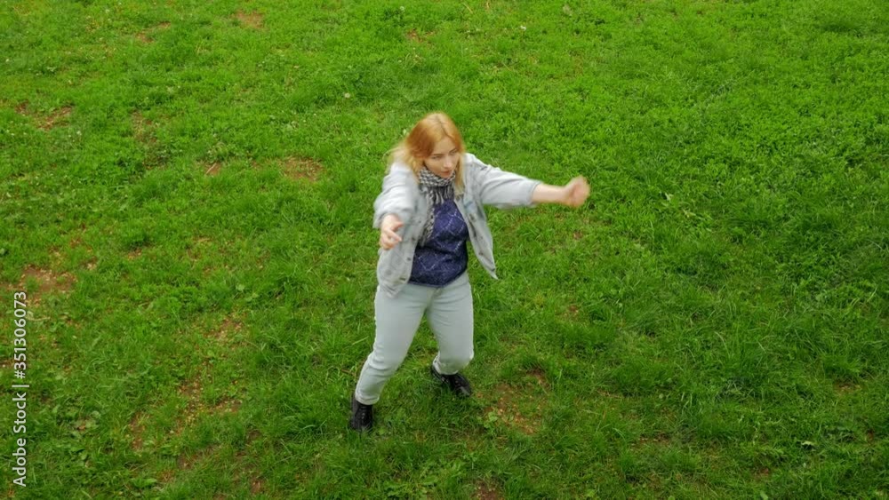 happy young woman dancing and running in the field happy young woman dancing and running in the field