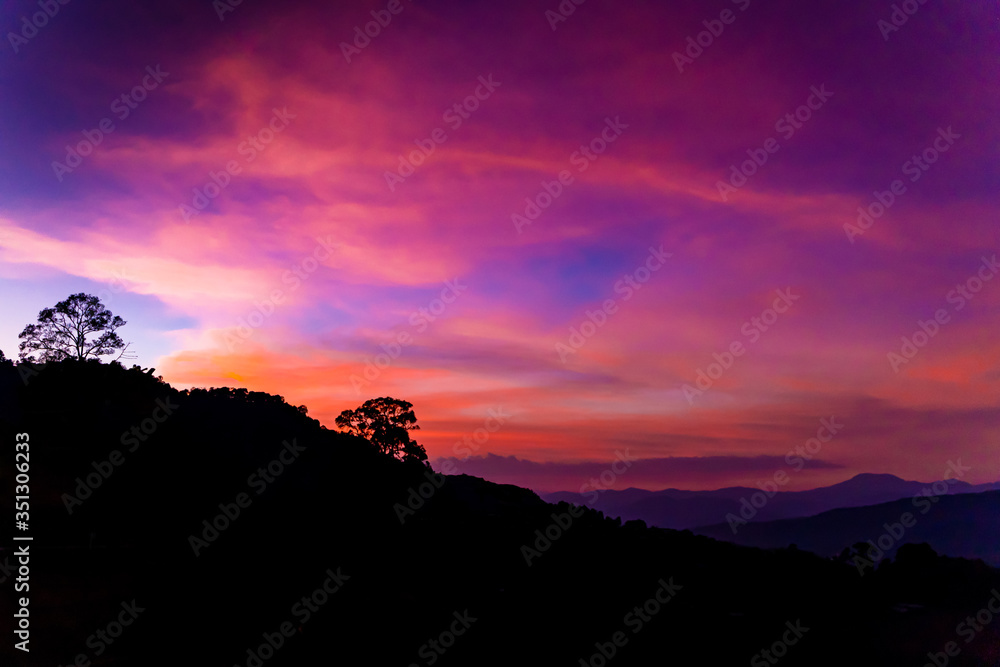 Beautiful Sky Silhouette Sunset at Mountain Hill in the Evening Twilight Time. Peaceful Concept Copy Space.