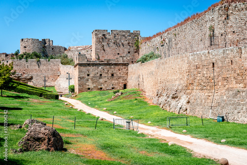 View of the Medieval Moat and the Medieval City Walls in Rhodes Island, Greece.