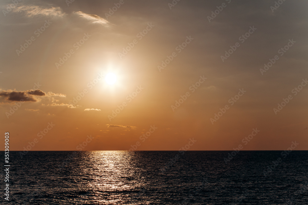Beautiful warm sunset on the sea. Beautiful scenery. Charming sunset