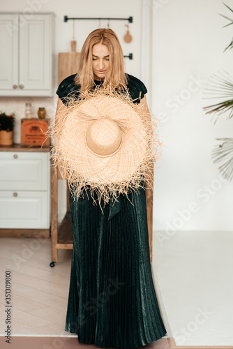 Middle-aged blond woman in her kitchen. Toning. photo