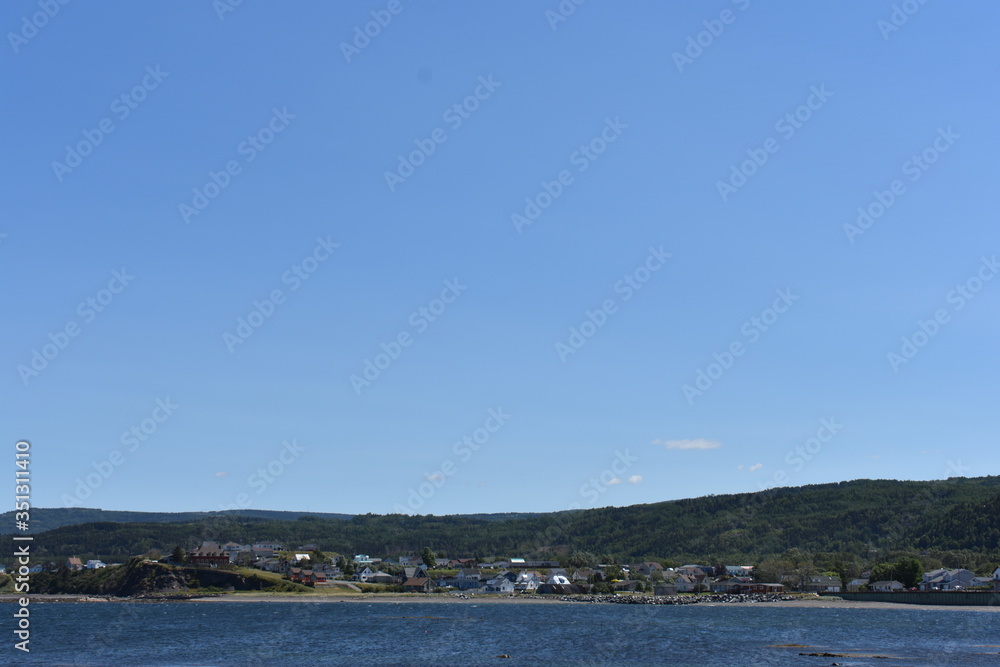 View of the coastline with ocean and mountains View of the coastline with ocean and mountains