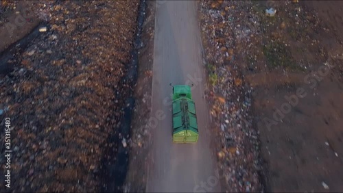Wallpaper Mural A huge city garbage dump. The truck moves among pile of toxic residue from industrial areas. Environmental pollution problem, ecological disaster, recycling concept. Ariel view Torontodigital.ca