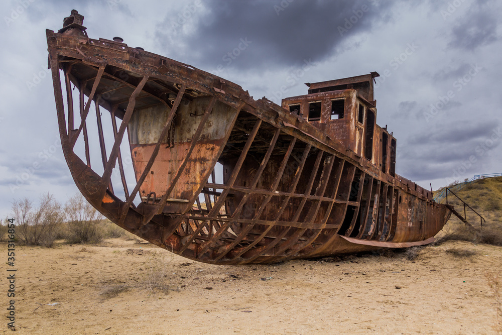 Rusting ship at the Ship Cemetery near Moynaq village at the former coast of Aral Sea, Uzbekistan