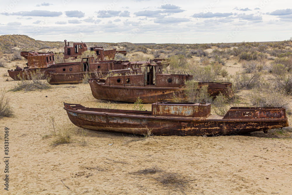 Rusty ships at the ship graveyard in former Aral sea port town Moynaq (Mo‘ynoq or Muynak), Uzbekistan Rusty ships at the ship graveyard in former Aral sea port town Moynaq (Mo‘ynoq or Muynak), Uzbekistan