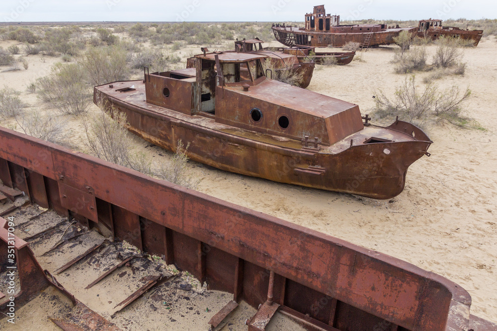 Rusty ships at the ship graveyard in former Aral sea port town Moynaq (Mo‘ynoq or Muynak), Uzbekistan Rusty ships at the ship graveyard in former Aral sea port town Moynaq (Mo‘ynoq or Muynak), Uzbekistan