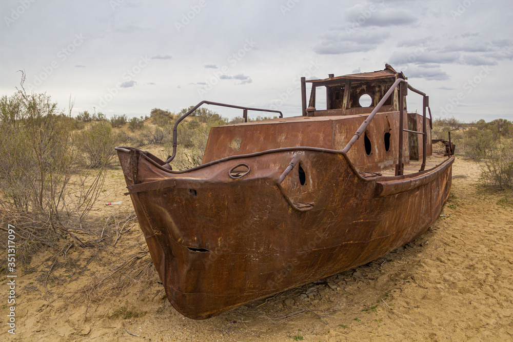 Rusty ship at the ship graveyard in former Aral sea port town Moynaq (Mo‘ynoq or Muynak), Uzbekistan