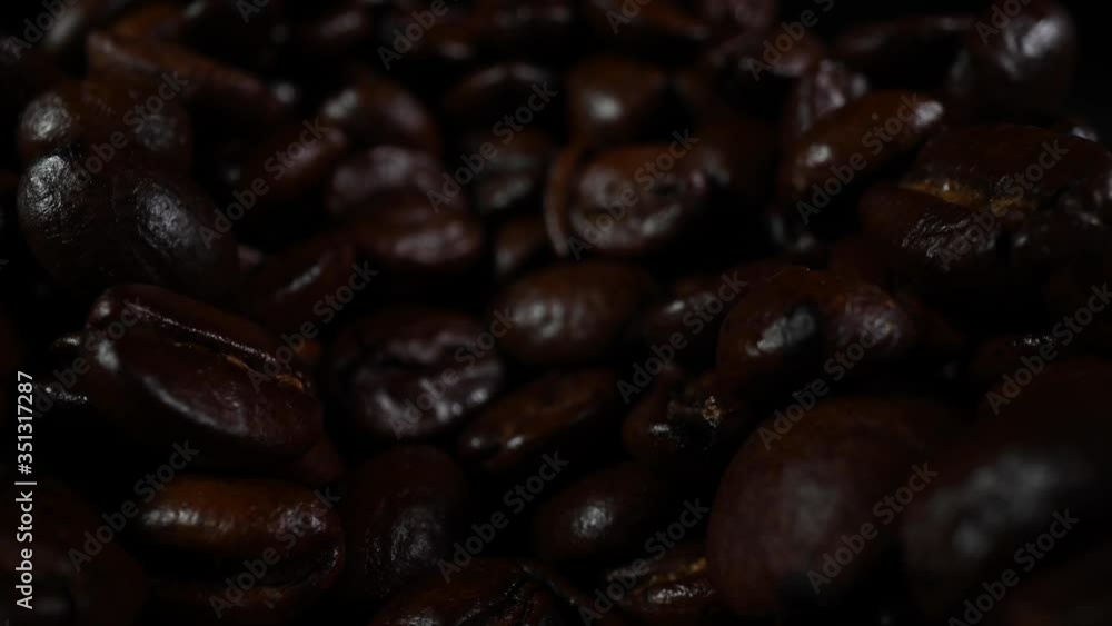 Pull Out Over Roasted Coffee Beans Scattered Across Surface Pull Out Over Roasted Coffee Beans Scattered Across Surface