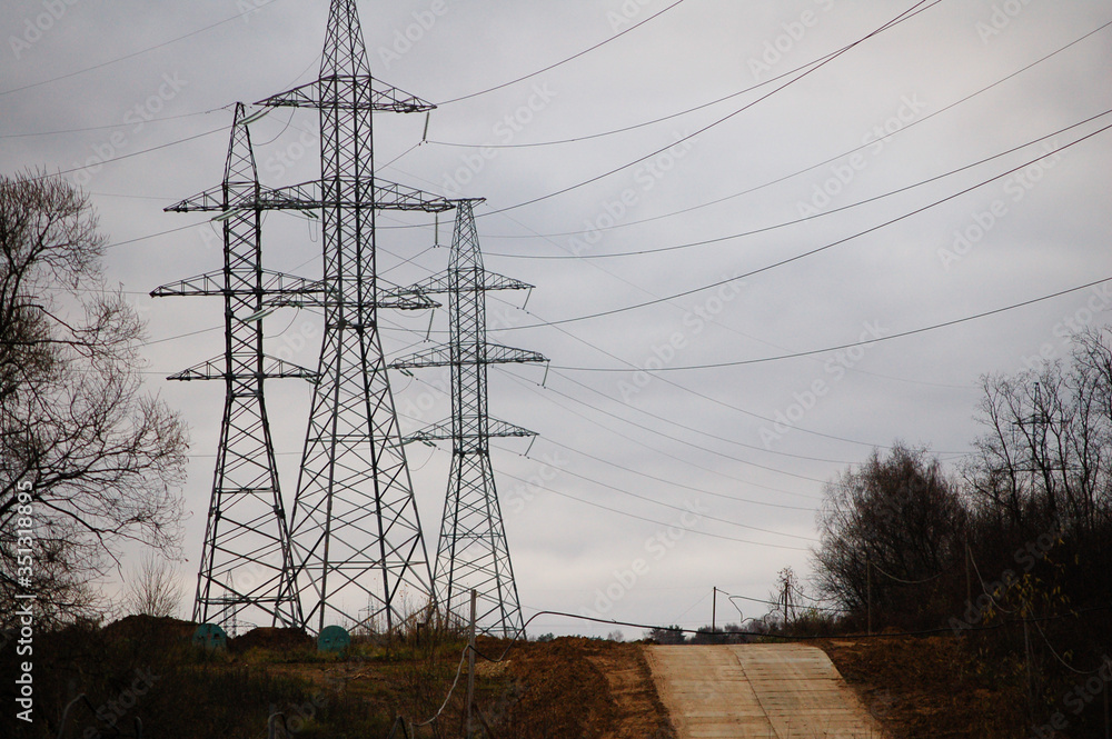 Fototapeta premium mountain road and high-voltage towers